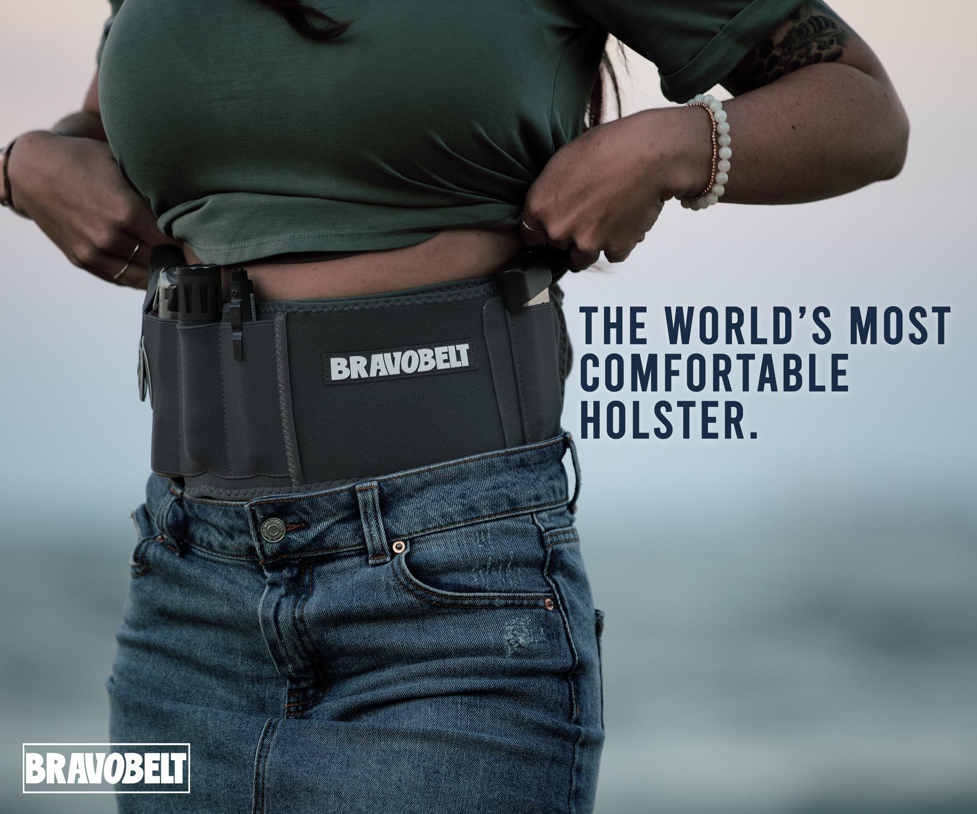A person demonstrating a concealed carry holster system (BravoBelt) showing fit around the waist and comfort.